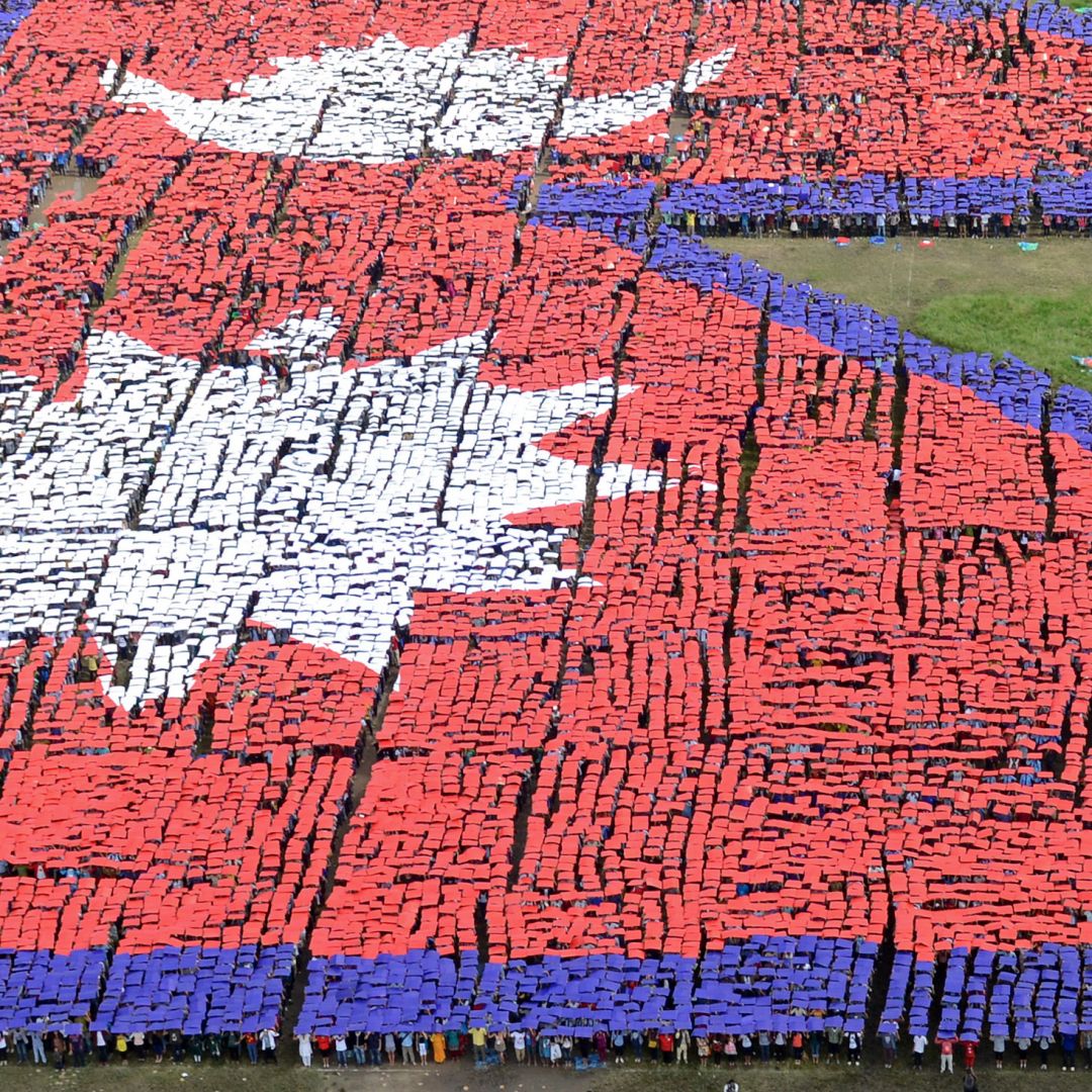 An aerial view of the Nepalese national flag formed by more than 35,000 people Aug. 23, 2014, in central Kathmandu, Nepal.