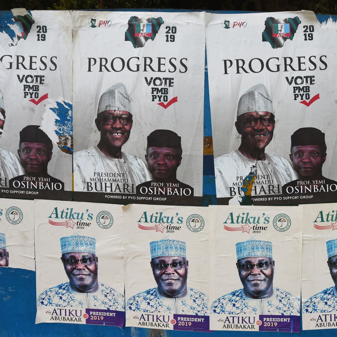 Campaign posters for the 2019 presidential election line a bus stop in Nigeria. Side-by-side campaign posters line a bus stop for President Muhammad Buhari and his challenger, Atiku Abubakar, ahead of the presidential election on Feb. 16.