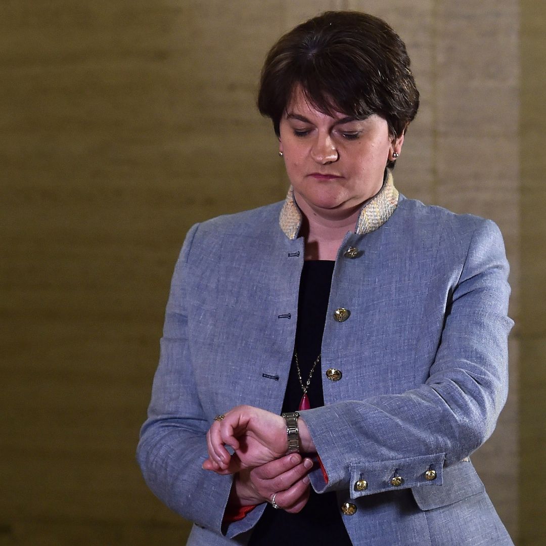 Northern Ireland’s first minister and leader of the Democratic Unionist Party (DUP), Arlene Foster, looks at her watch outside the Parliament Buildings in Belfast.