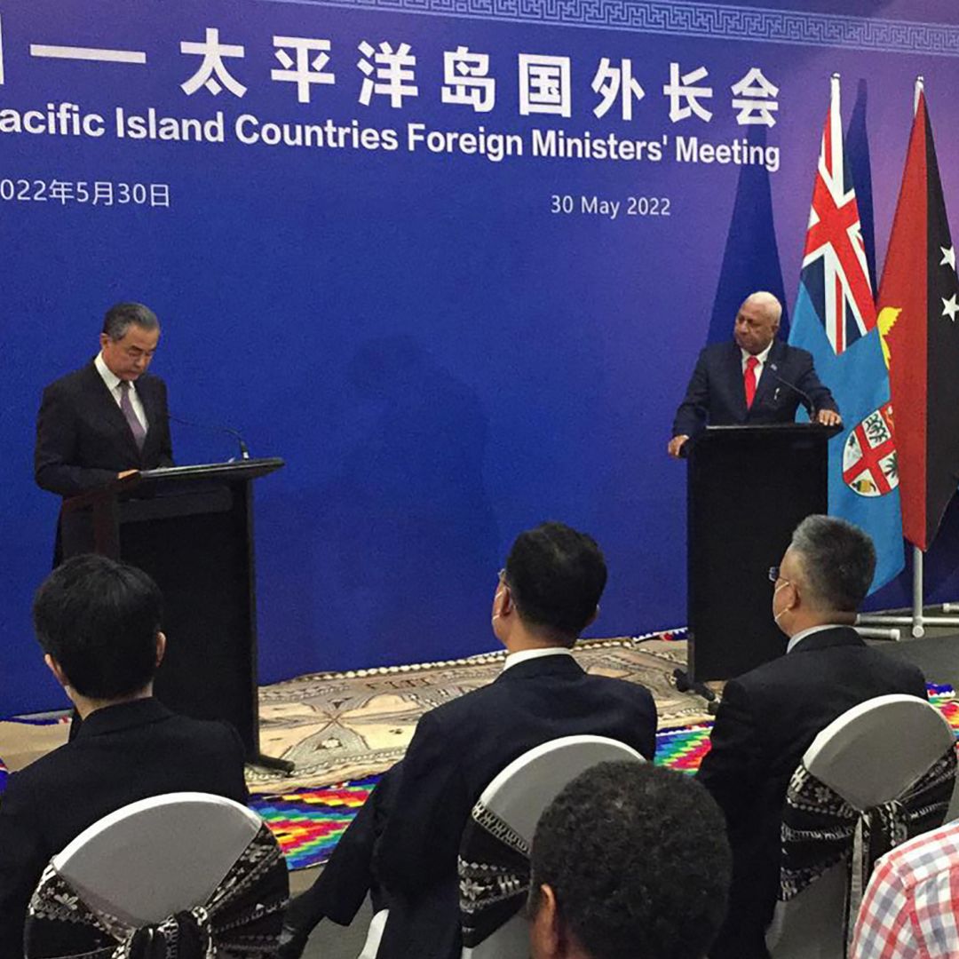 Visiting Chinese Foreign Minister Wang Yi (left) and Fiji's prime minister Frank Bainimarama attend a joint press conference in Fiji's capital of Suva on May 30, 2022.