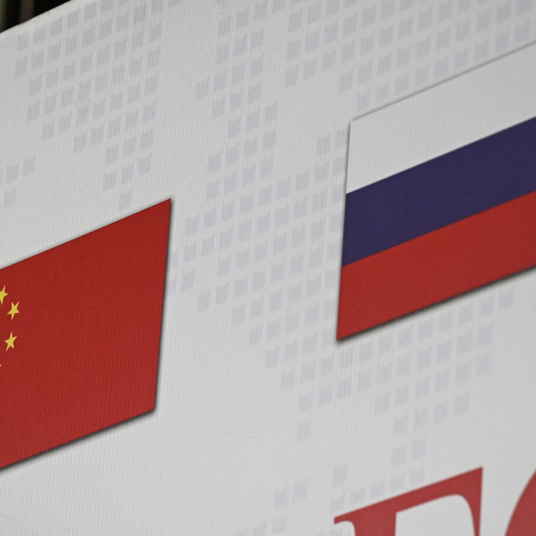 The Chinese and Russian national flags (R) on March 22, 2022, in Beijing. New Chinese Defense Minister Li Shangfu will meet with his counterpart, Sergei Shoigu, on April 16 in Russia to discuss global and regional security issues and bilateral military cooperation. The Chinese and Russian national flags (R) on March 22, 2022, in Beijing.