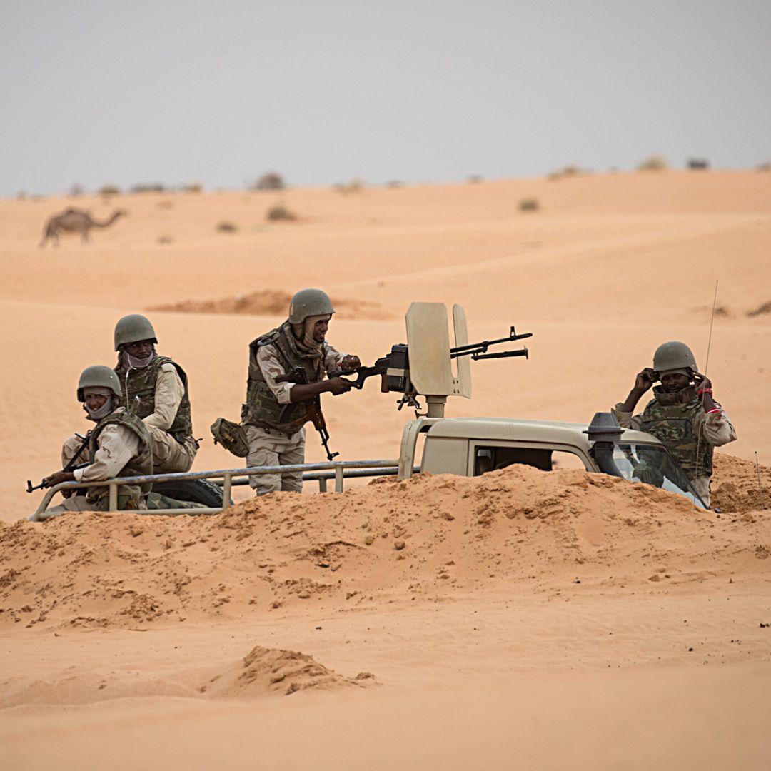 Soldiers stand guard at a G5 Sahel task force command post on Nov. 22, 2018, in Mauritania near the border with Mali.
