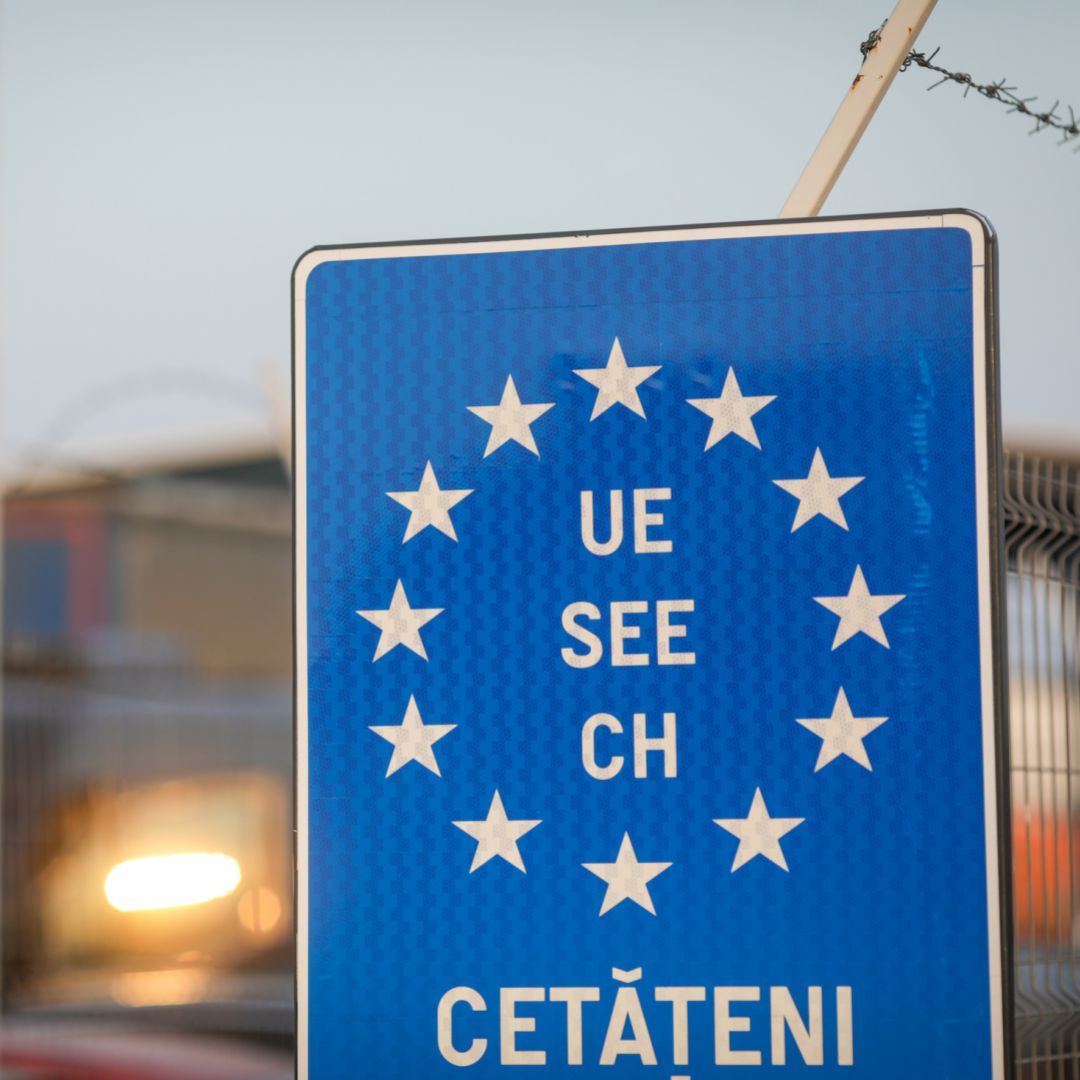 A blue EU sign is seen at a Romanian border crossing.