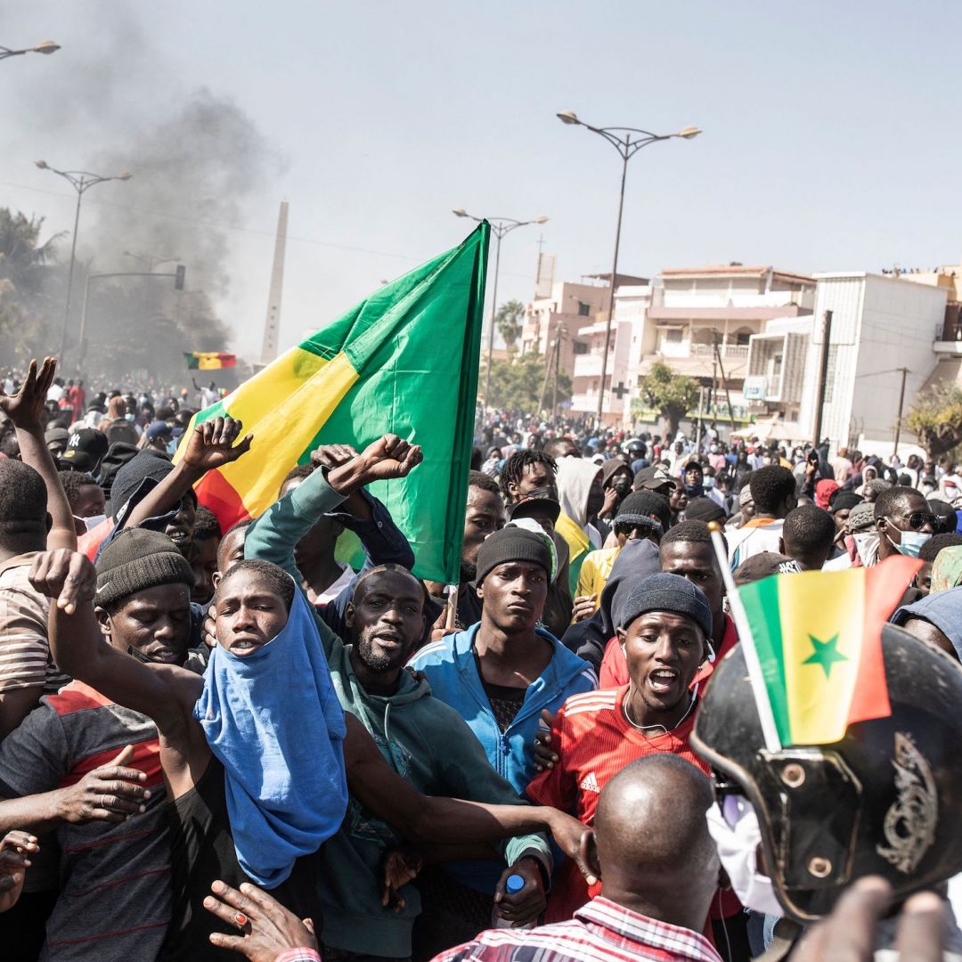 Protesters gather in the Senegalese capital of Dakar on March 8, 2021, after the country's opposition leader Ousmane Sonko was charged with rape. 