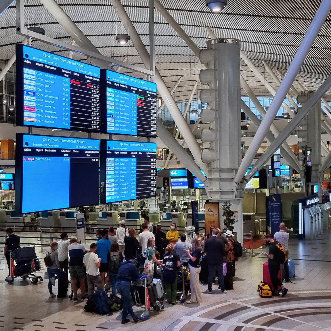 Passengers wait to check in for one of the last international flights out of Cape Town, South Africa, after countries began imposing travel bans to contain the spread of the new Omicron COVID-19 variant on Nov. 29, 2021. 