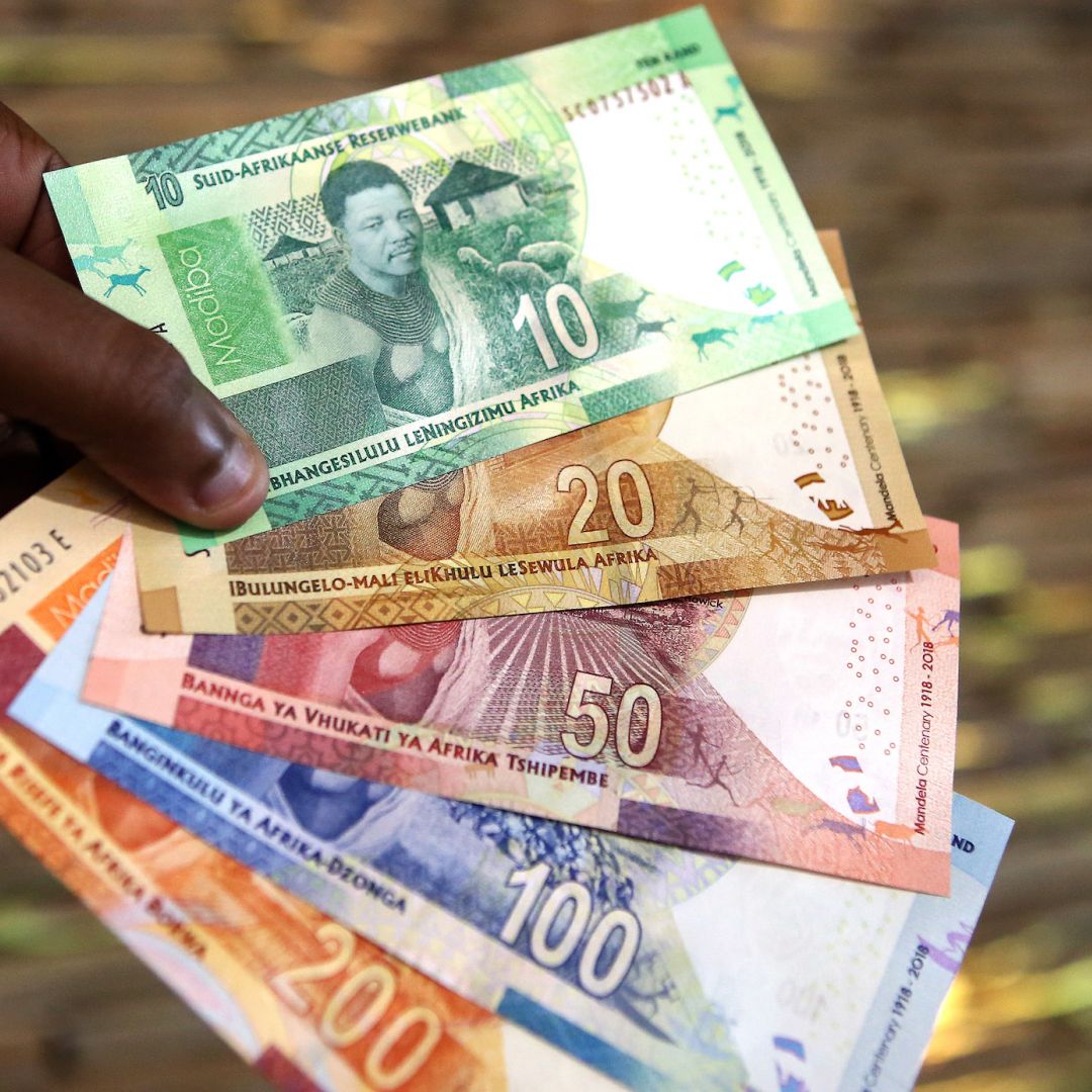 A man holds new South African banknotes of the South African rand on July 13, 2018, in Pretoria, South Africa. 