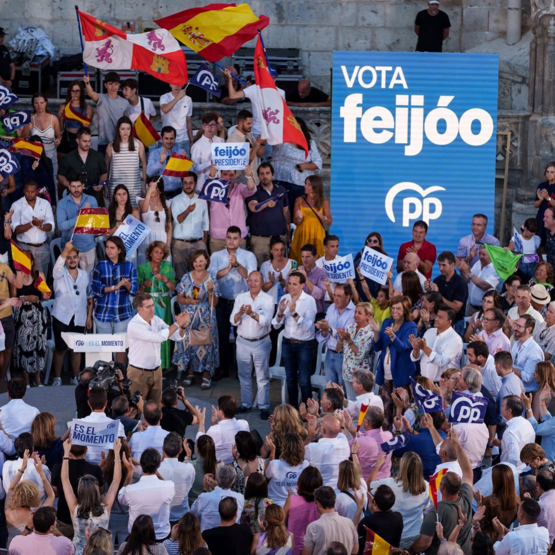 Alberto Nunez Feijoo (center, white shirt), the leader of Spain's right-wing People's Party, gestures to supporters at a campaign rally in Burgos, Spain, on July 13, 2023.