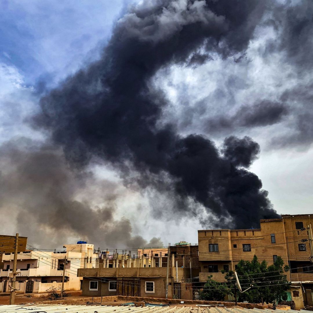 Smoke plumes billow from a fire at a lumber warehouse in southern Khartoum amidst ongoing fighting on June 7, 2023. 