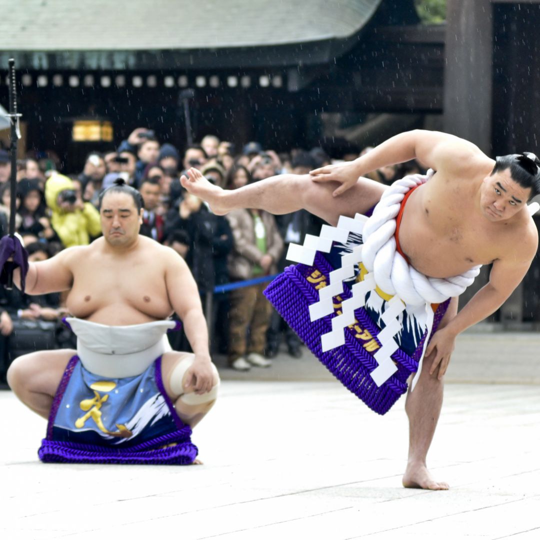 Mongolian-born Harumafuji Kohei (r) is one of only 72 sumo wrestlers in the centuries-old history of the sport to attain the rank of yokozuna, or grand champion.
