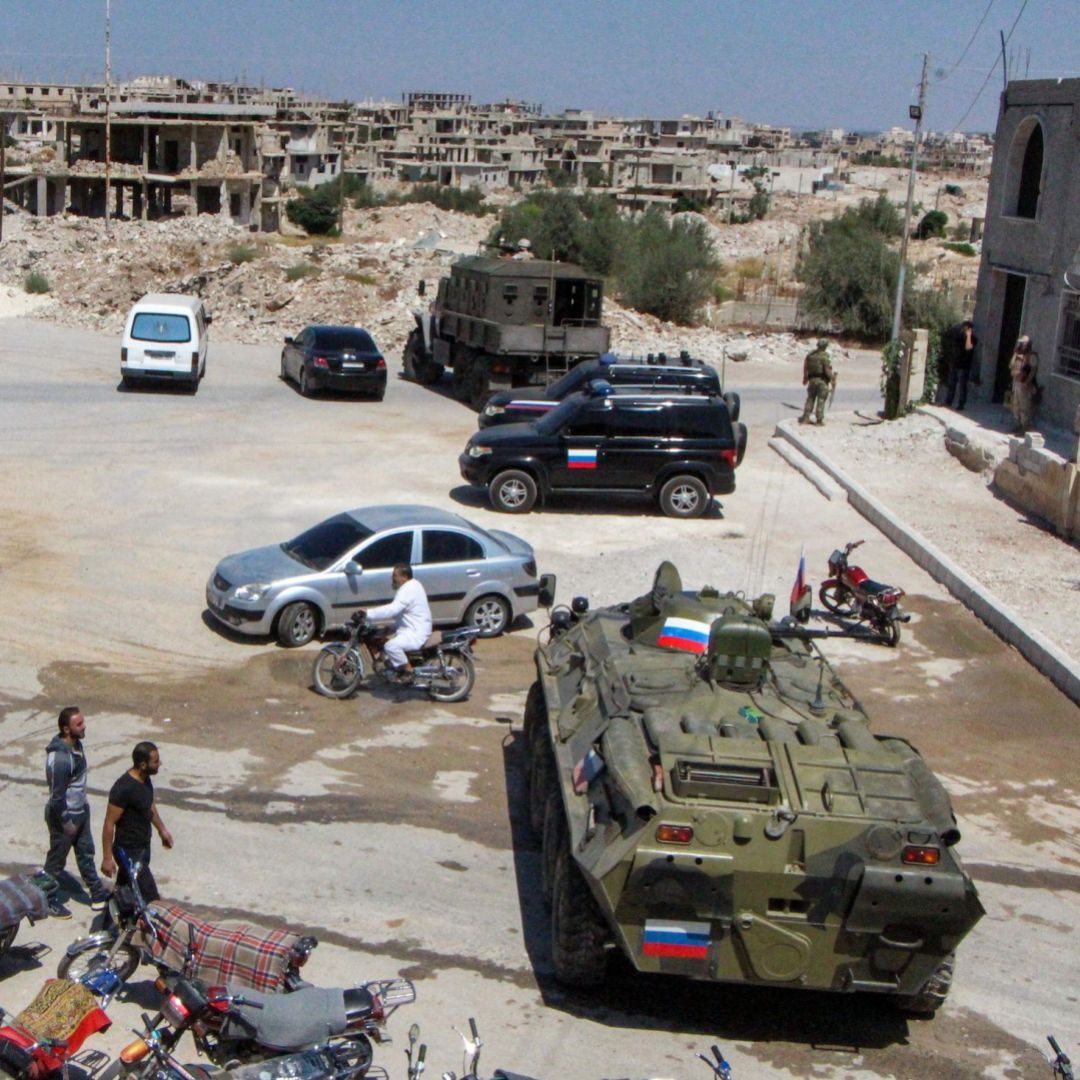 Russian military vehicles are seen in the southern Syrian city of Daraa on Sept. 6, 2021.