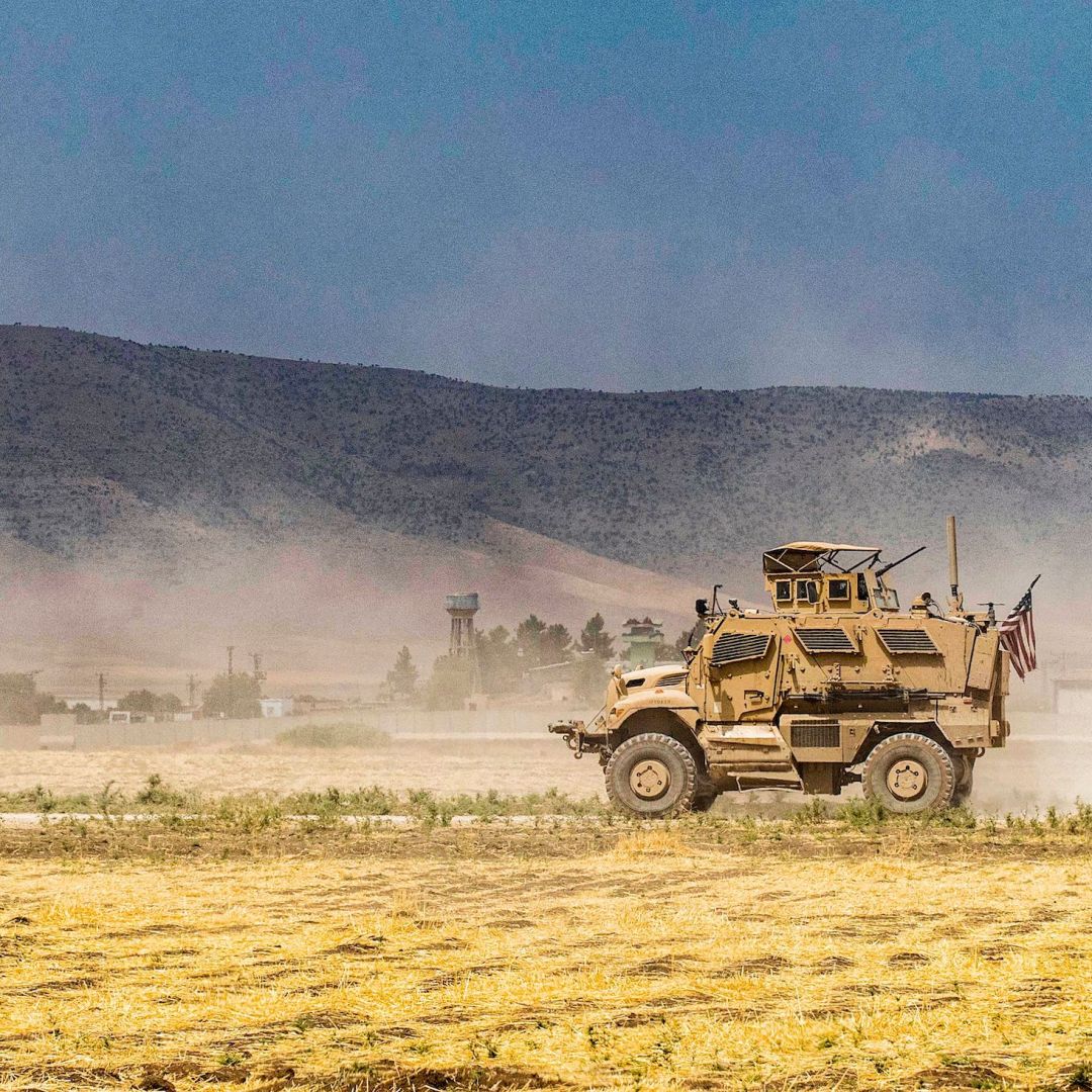 A U.S. Oshkosh M-ATV Mine Resistant Ambush Protected military vehicle patrols near the Syria-Turkey border in a village east of Qamishli in Syria's northeastern Hasakah province on Aug. 21. The village was subject to bombardment the previous week. A U.S. Oshkosh M-ATV Mine Resistant Ambush Protected military vehicle patrols near the Syria-Turkey border in a village east of Qamishli in Syria's northeastern Hasakah province on Aug. 21. The village was subject to bombardment the previous week.