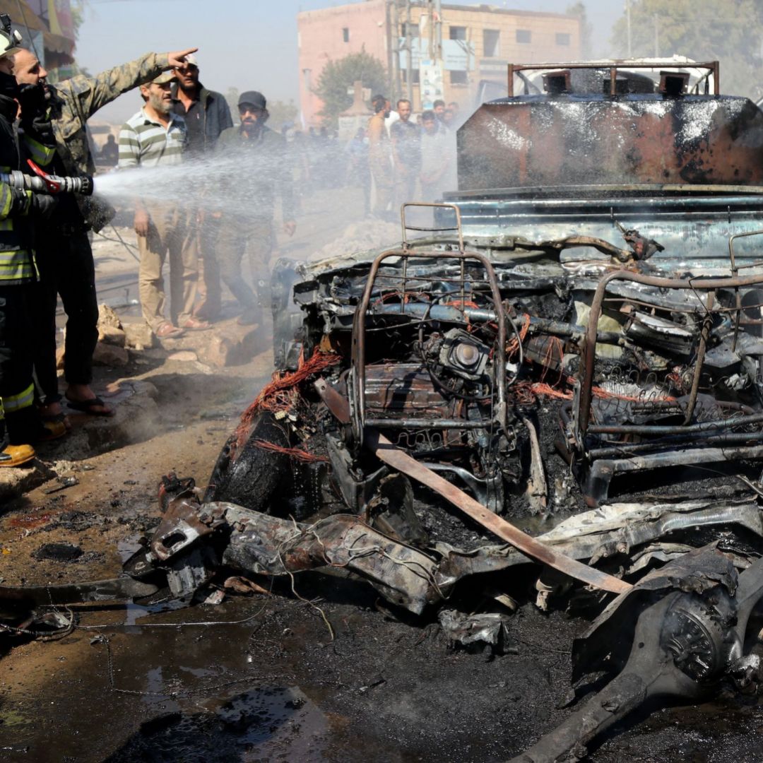 A vehicle destroyed in a bombing is seen in Syria's rebel-held northern city of Afrin on Oct. 11, 2021. 