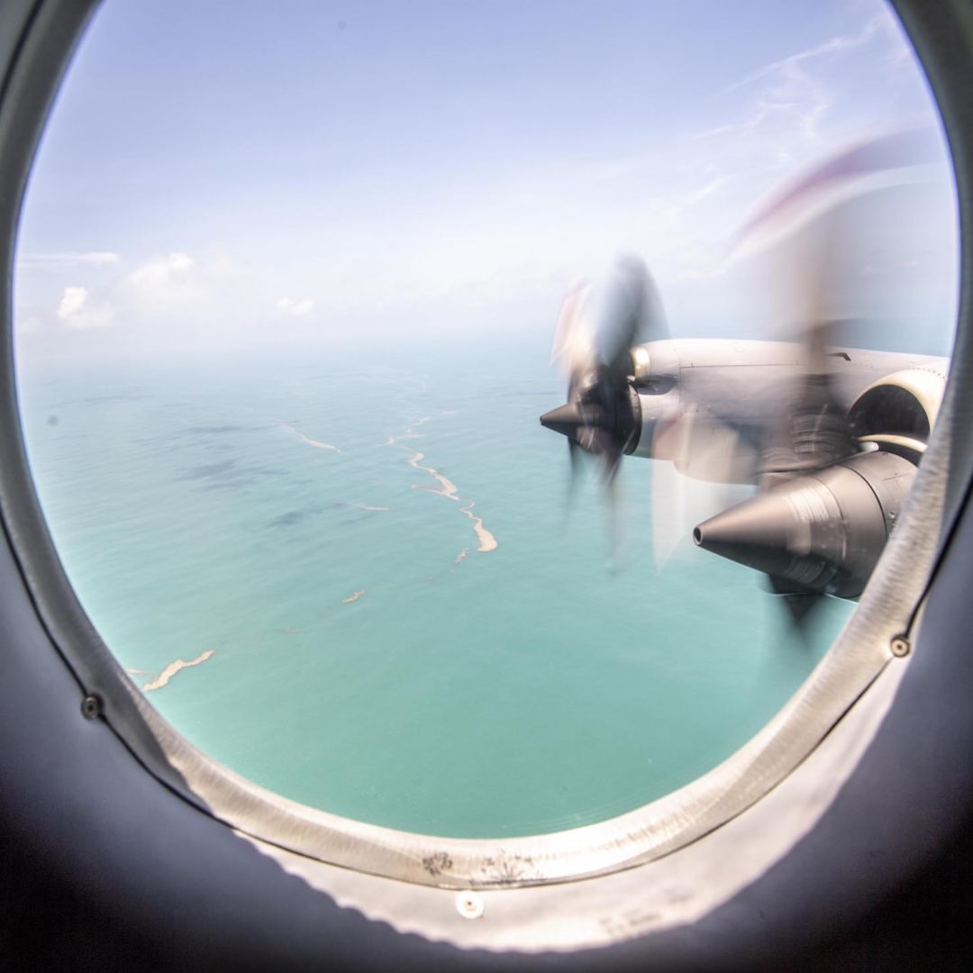 A P-3K2 Orion aircraft flying over Tonga's Nomuka island shows heavy ash fall from the recent volcanic eruption within the Tongan Islands on Jan. 17.