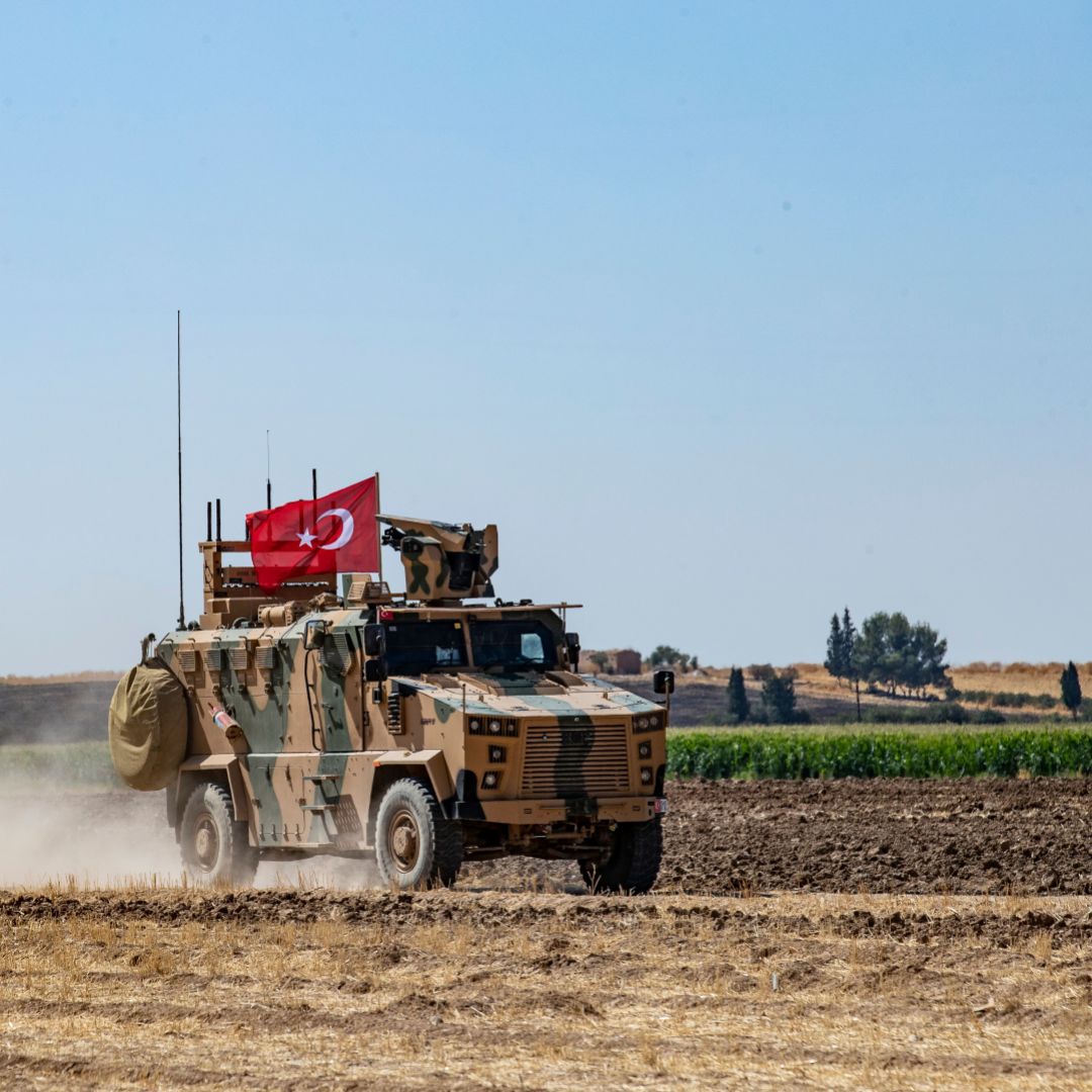 In this photo taken on Sept. 24, 2019, a Turkish military vehicle participates in a joint patrol with the United States near the Syrian border with Turkey. The joint patrols were aimed at easing tensions between Turkey and U.S.-backed Kurdish forces.