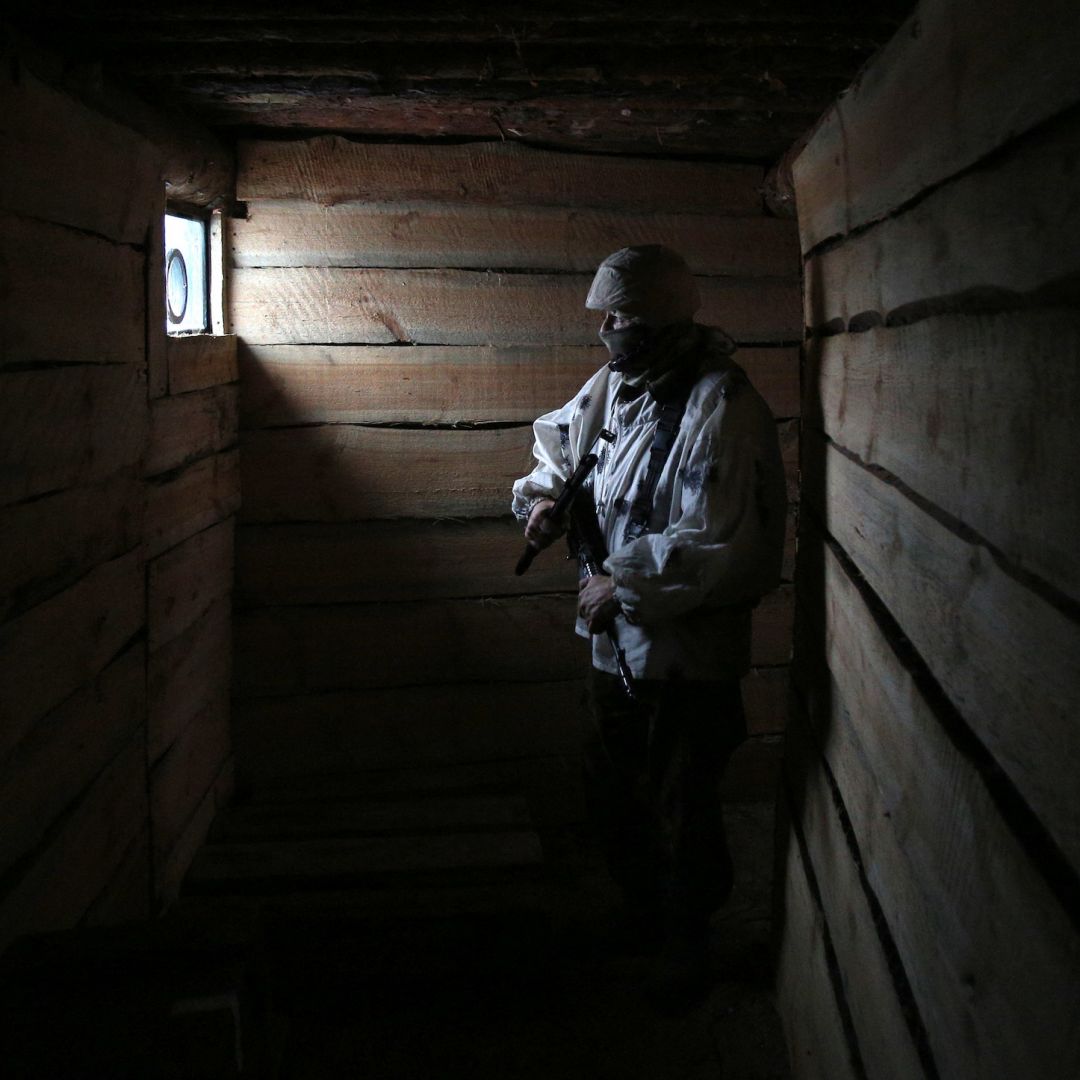 A Ukrainian serviceman is seen in a dugout in the Donetsk region of eastern Ukraine on Feb. 2, 2022. A Ukrainian serviceman is seen in a dugout in the Donetsk region of eastern Ukraine on Feb. 2, 2022.