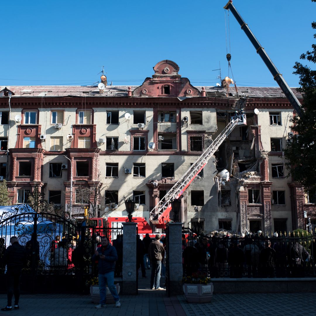 People in Zaporizhzhia, Ukraine, stand near a residential building that was damaged in fighting with Russian troops, as rescuers conduct a search and rescue operation, on Oct. 18, 2023. People in Zaporizhzhia, Ukraine, stand near a residential building that was damaged in fighting with Russian troops, as rescuers conduct a search and rescue operation, on Oct. 18, 2023.