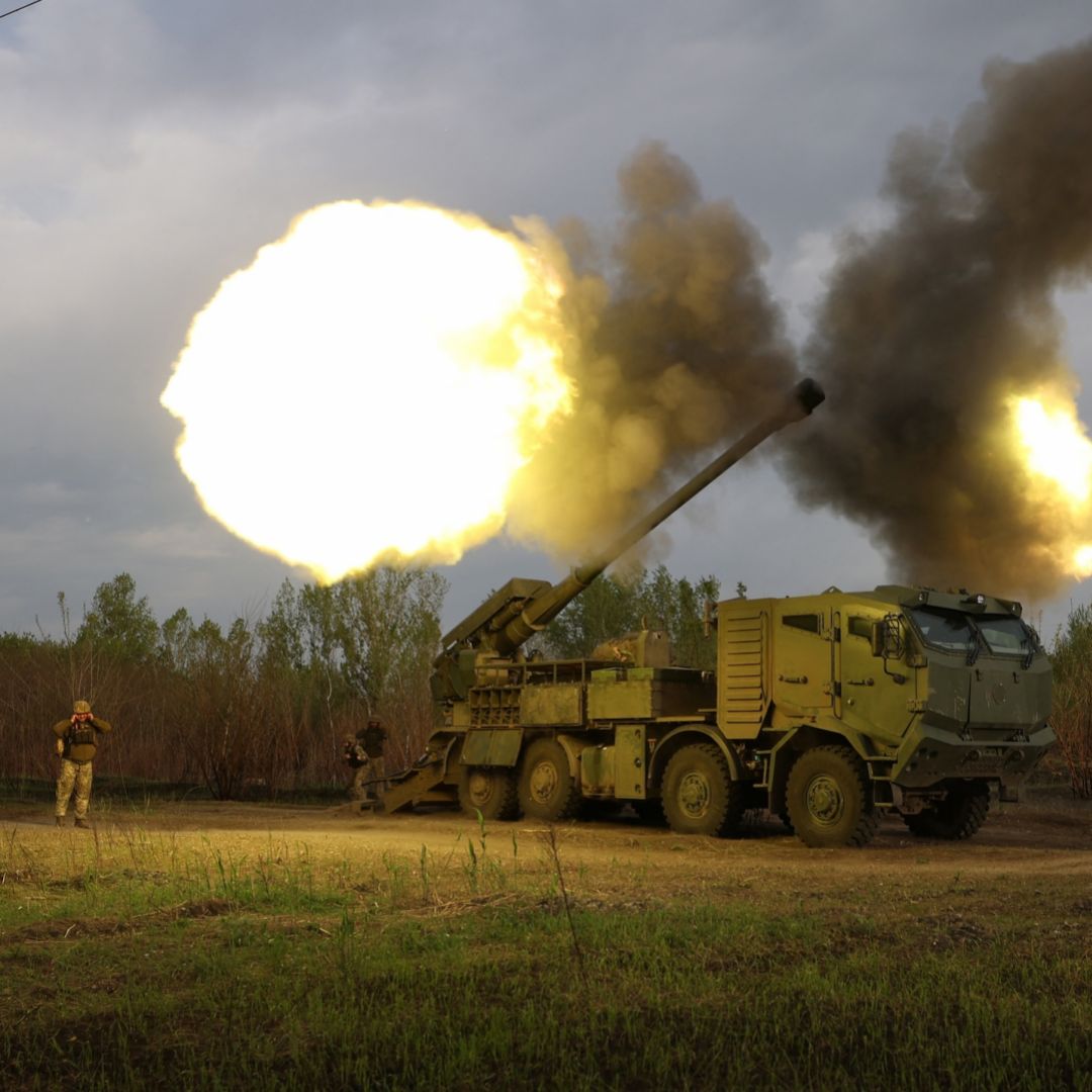Ukrainian soldiers fire at a Russian position in Ukraine's Kharkiv region on April 21, 2024. 