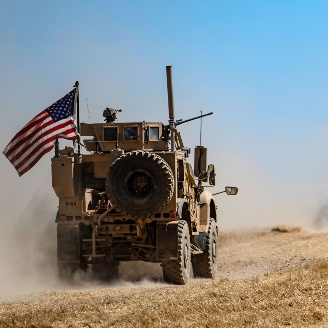 A U.S. military convoy patrols a Syrian village along the Turkish border on Sept. 8, 2019.