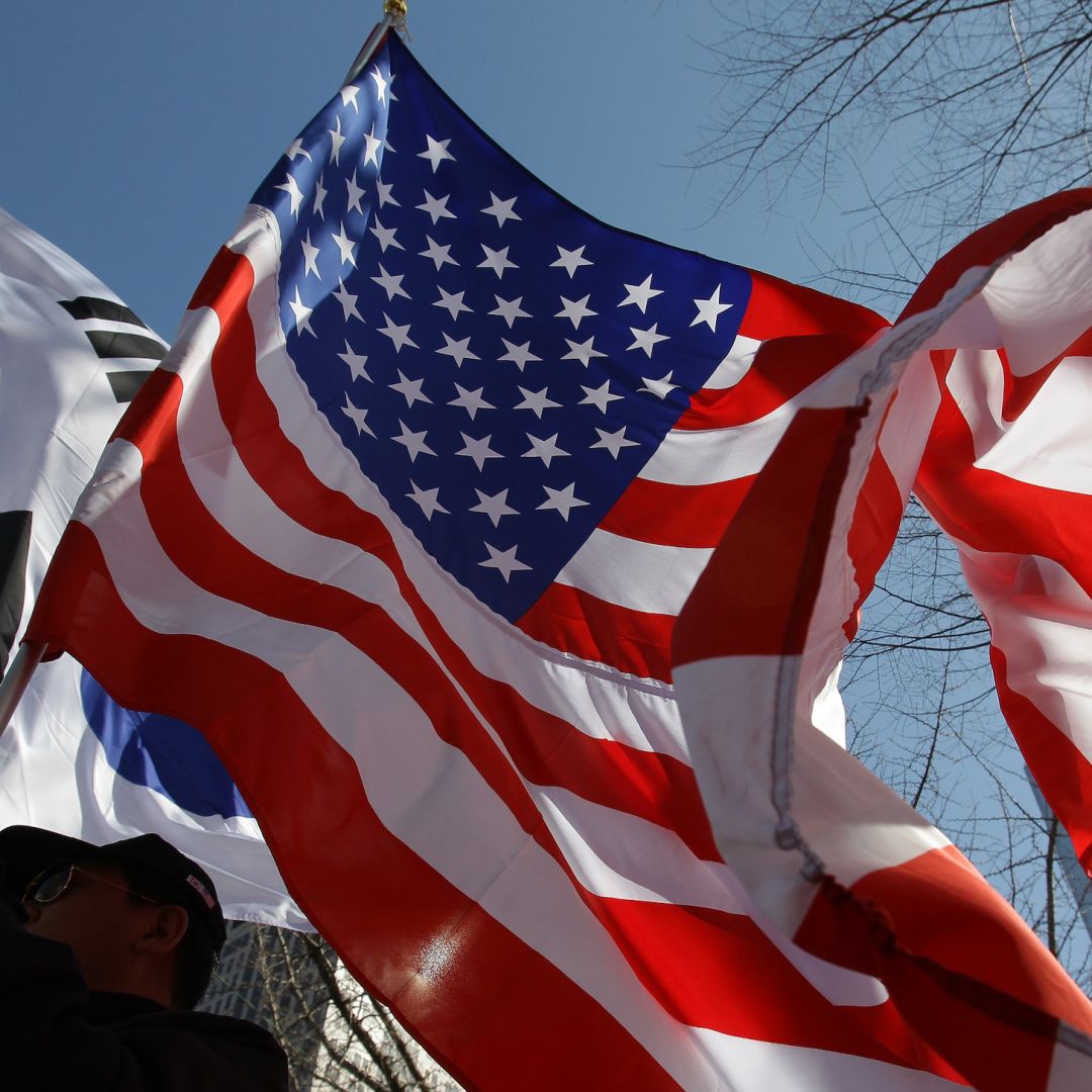 U.S. and South Korean flags are waved March 10, 2015, in Seoul, South Korea.