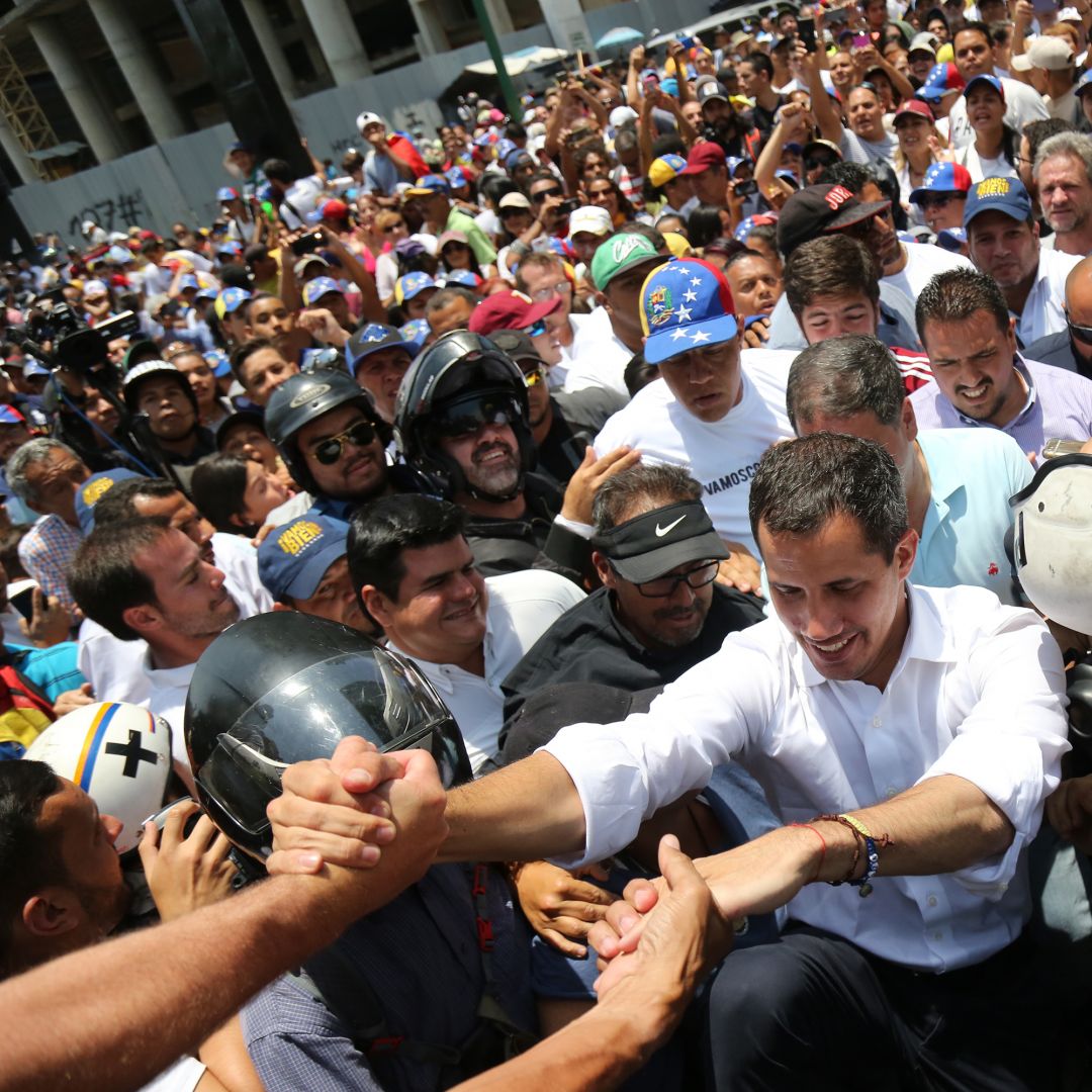 Opposition leader Juan Guaido arrives at a demonstration in the Venezuelan capital of Caracas. Juan Guaido, leader of the political opposition movement in Venezuela, greets supporters at a demonstration on May 1, 2019.