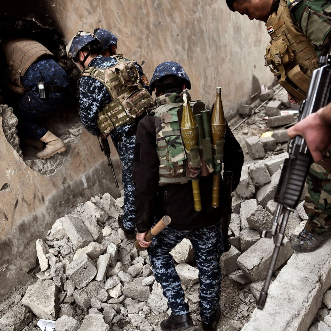 Iraqi troops clear house-by-house, moving toward the Old City in western Mosul on March 13.