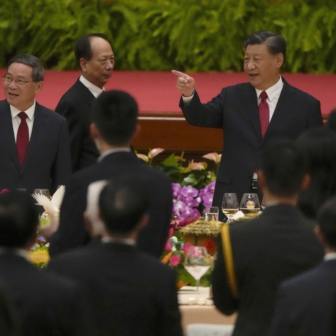 Chinese President Xi Jinping (right) gestures as he and his Premier Li Qiang (left) arrive for a dinner marking the 74th anniversary of the founding of the People's Republic of China on Sept. 28, 2023, in Beijing, China. Chinese President Xi Jinping (right) gestures as he and his Premier Li Qiang (left) arrive for a dinner marking the 74th anniversary of the founding of the People's Republic of China on Sept. 28, 2023, in Beijing, China.