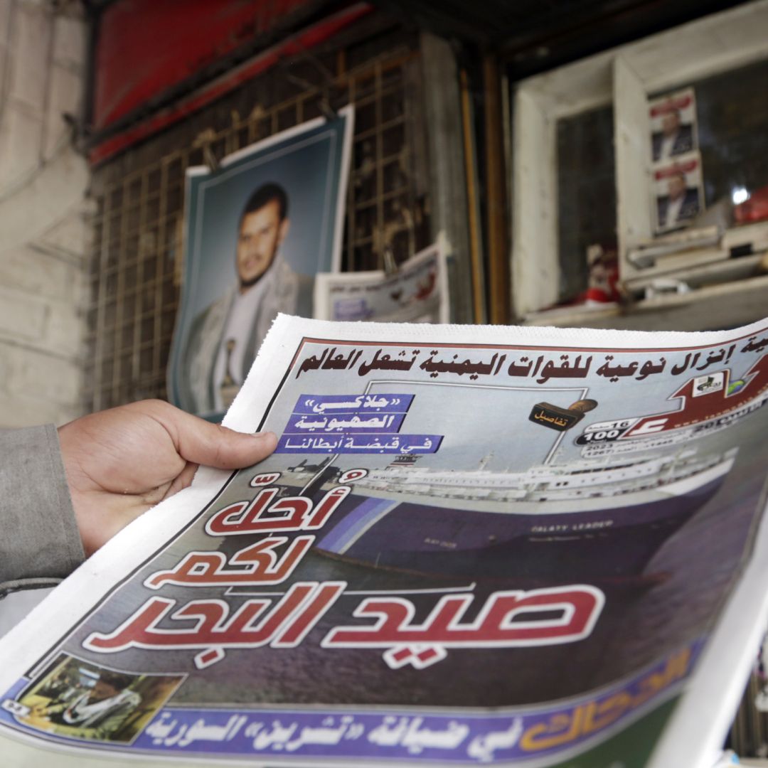A Yemeni man about the alleged Houthi-linked hijacking of an Israeli ship in the Red Sea at a newsstand on Nov. 20, 2023, in Sanaa, Yemen.
