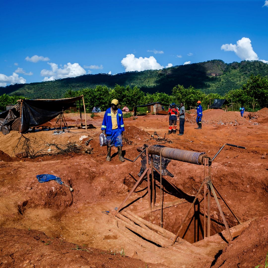 Miners walk near a mine shaft at Manzou Farm, owned by Grace Mugabe, wife of former Zimbabwean President Robert Mugabe, in Mazowe, Zimbabwe, on April 5, 2018.