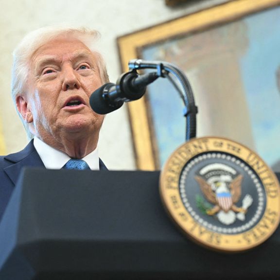 A portrait of former U.S. President Ronald Reagan is seen in the background as U.S. President Donald Trump speaks to reporters in the Oval Office of the White House in Washington, D.C., on April 22, 2025. A portrait of former U.S. President Ronald Reagan is seen in the background as U.S. President Donald Trump speaks to reporters in the Oval Office of the White House in Washington, D.C., on April 22, 2025.