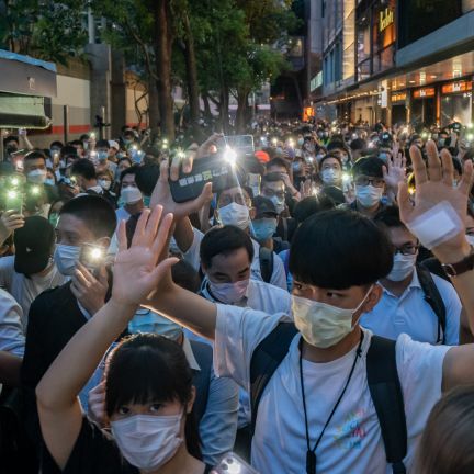 Pro-democracy protesters shine the flashlights on their cellphones as they take part in a rally in Hong Kong on June 9, 2020. Pro-democracy protesters shine the flashlights on their cellphones as they take part in a rally in Hong Kong on June 9, 2020.