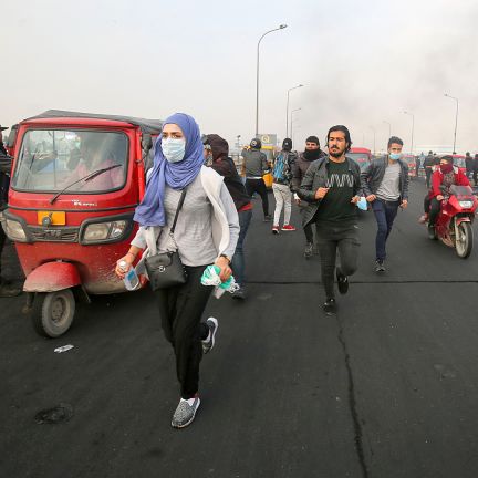 Iraqi protesters run for cover during a recent anti-government demonstration in Baghdad. Iraqis run for cover during an anti-government demonstration in Baghdad on Jan. 23, 2020. Protests have rocked Iraq since October but recently had abated amid spiraling tensions between the country's key allies, the United States and Iran.