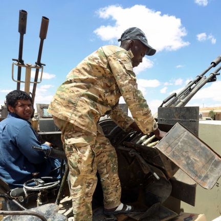 Fighters aligned with Libya's internationally-recognized Government of National Accord (GNA) patrol a village located halfway between Tripoli and Benghazi on July 20, 2020. Fighters aligned with Libya's internationally-recognized Government of National Accord (GNA) patrol a village located halfway between Tripoli and Benghazi on July 20, 2020.