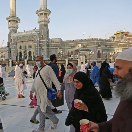 Muslim pilgrims wear masks at the Grand Mosque in Saudi Arabia's holy city of Mecca on Feb. 28, 2020. Muslim pilgrims wear masks at the Grand Mosque in Saudi Arabia's holy city of Mecca on Feb. 28, 2020.