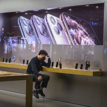 At present, the new coronavirus will not have a huge effect on China's technology industry, since Hubei province is not a critical node in the country's overall technology sector. But that change if the outbreak starts to affect neighboring provinces. An employee sits in the showroom of an Apple store in Beijing after it closed for the day on Feb. 1, 2020.