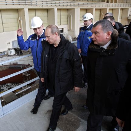 Putin switched on the first turbine at a Siberian hydroelectric plant where 75 people died in a disaster in August last year, Russian agencies reported. Vladimir Putin walks alongside workers at a hydroelectric plant.