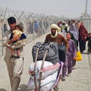 Stranded Afghan nationals arrive to return back to Afghanistan at the Pakistan-Afghanistan border crossing point in Chaman on Aug. 16, 2021. 