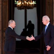 Russian President Vladimir Putin (L) shakes hands with U.S. President Joe Biden on June 16, 2021, at a summit at the Villa La Grange, in Geneva.