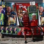 Street vendors offer towels depicting presidential candidates Lula Da Silva and Jair Bolsonaro on Sept. 24, 2022, in downtown Rio de Janeiro. Bolsonaro's charges against the country's electoral authority and widespread disinformation have created the conditions for him to contest the election results. Street vendors offer towels depicting presidential candidates Lula Da Silva and Jair Bolsonaro on Sept. 24, 2022, in downtown Rio de Janeiro.