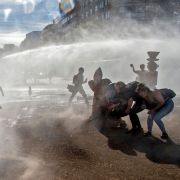 Demonstrators clash with riot police following a protest against the Chilean government Dec. 18, 2019, in Santiago, Chile.