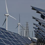 Solar panels and wind turbines work in an integrated power station in Yancheng, China, on Oct. 14, 2020. Solar panels and wind turbines work in an integrated power station in Yancheng, China, on Oct. 14, 2020.