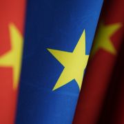 Chinese and EU flags stand at the chancellery on Jan. 26, 2021, in Berlin, Germany. The two entities recently reached a comprehensive agreement on investment. 