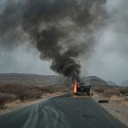 A truck, carrying grains to Tigray and belonging to the World Food Programme (WFP), burns out on a route 80 kilometers from Semera in northeastern Ethiopia, on June 10, 2022. 