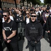 Supporters of the neo-Nazi Nordic Resistance Movement chant slogans during a demonstration in Stockholm, Sweden on Aug. 25, 2018. Supporters of the neo-Nazi Nordic Resistance Movement chant slogans during a demonstration in Stockholm, Sweden on Aug. 25, 2018.
