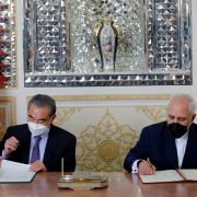 Iran and China’s foreign ministers (right to left) sign a partnership agreement in Tehran on March 27, 2021. Iran and China’s foreign ministers (right to left) sign a partnership agreement in Tehran on March 27, 2021.