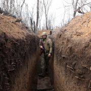 A Ukrainian serviceman in a trench on the frontline with Russia-backed separatistsApril 23, 2021, near the town of Krasnogorivka in the Donetsk region of eastern Ukraine.