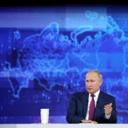 Russian President Vladimir Putin takes calls from citizens at a studio in Moscow during a televised phone-in event. 
