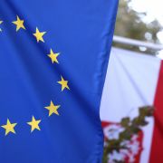 The EU and Polish flags are seen at the entrance of the Polish Permanent Representation to the European Union on Oct. 8, 2021, in Brussels, Belgium. 