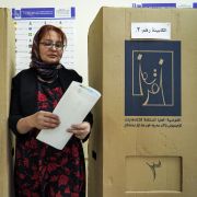 A woman walks to cast her ballot in Iraq’s parliamentary election at a polling station in Dohuk on Oct. 10, 2021. A woman walks to cast her ballot in Iraq’s parliamentary election at a polling station in Dohuk on Oct. 10, 2021.
