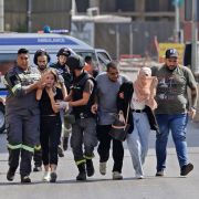 Lebanese medics help evacuate civilians during clashes in the Tayouneh area of Beirut on Oct. 14, 2021. Lebanese medics help evacuate civilians during clashes in the Tayouneh area of Beirut on Oct. 14, 2021.