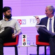 Chilean presidential candidates Gabriel Boric (left) and Jose Kast talk during a debate in Santiago, Chile, on Nov. 2, 2021. 